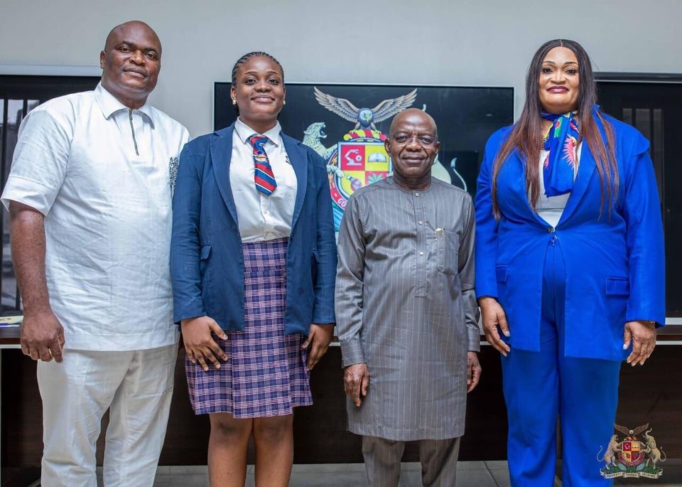 Officials and a student at a presentation event, July 2025