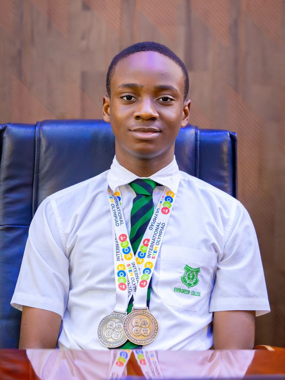 A student wearing his medals, July 2026